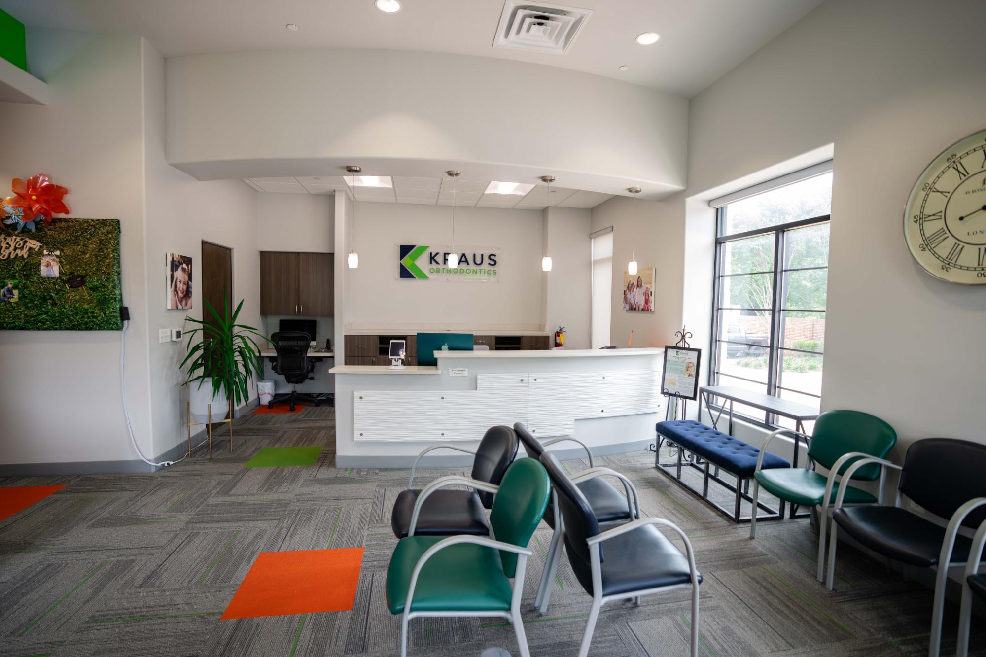 Welcoming reception area of Kraus Orthodontics with modern decor, friendly seating, and a bright, comfortable atmosphere for new patients.